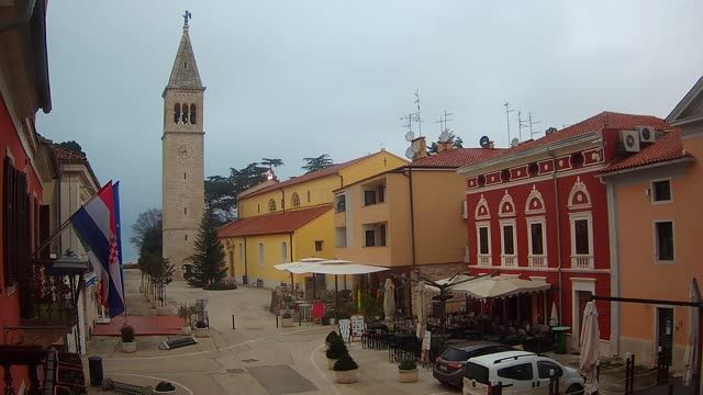 Square with tower on Velika street in Novigrad city, Croatia.